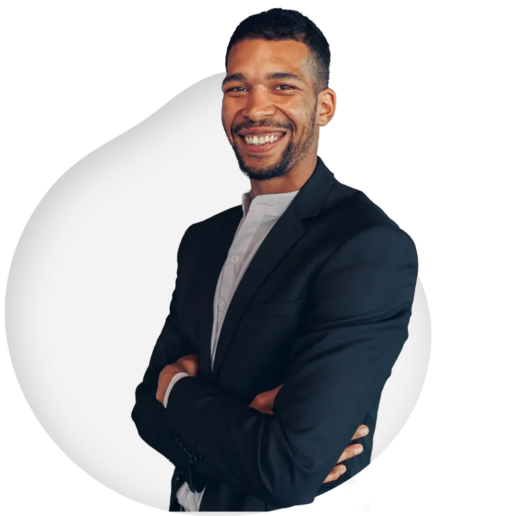 man smiling with arms crossed