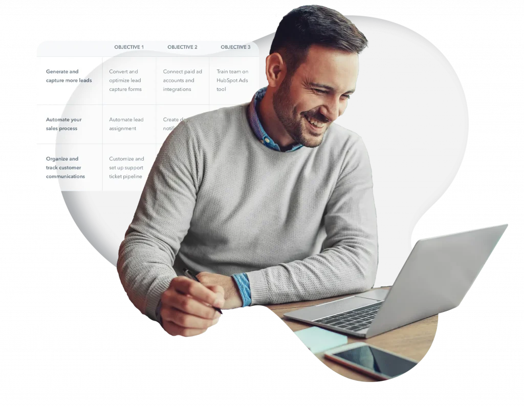 man smiling while on laptop